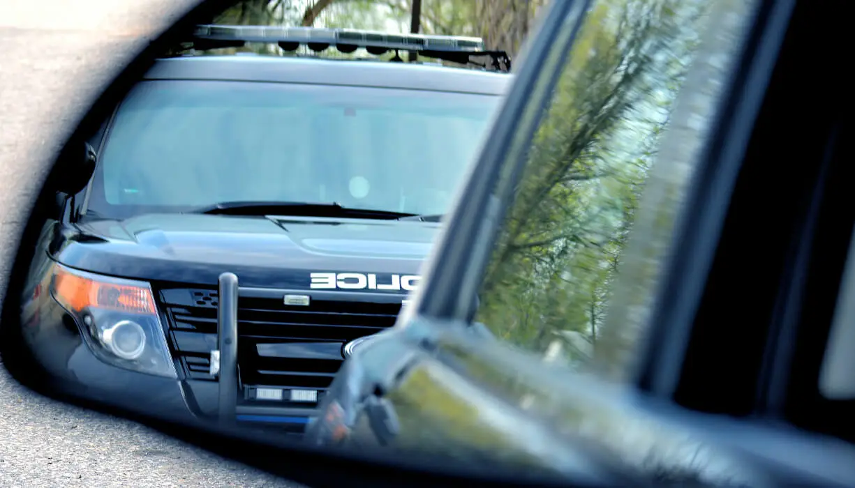 A police car has a driver stopped for a DUI violation